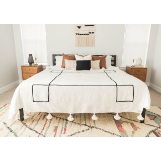 Handwoven Moroccan Pom Pom Blanket • wool throw blanket with black pattern • home decor and cozy snuggling • customizable dimensions.