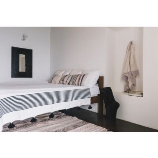 Hand-Woven Moroccan Pom Pom Blanket in White with Black Pom Poms