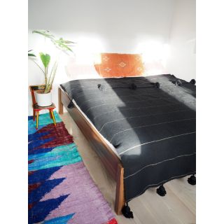 Moroccan Pom Pom Wool Blanket with Black Poms. Luxurious & Versatile Dark Grey Throw - Handwoven by Artisans.